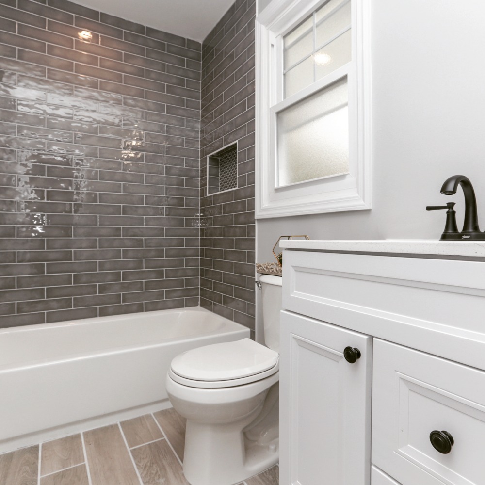 Bathroom renovation with glass shower enclosure