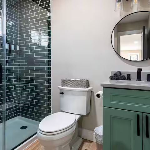 Bathroom remodel with updated lighting and tile